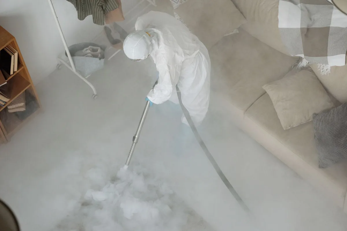 Biohazard cleanup technician in protective equipment, Northwest District, Portland, OR